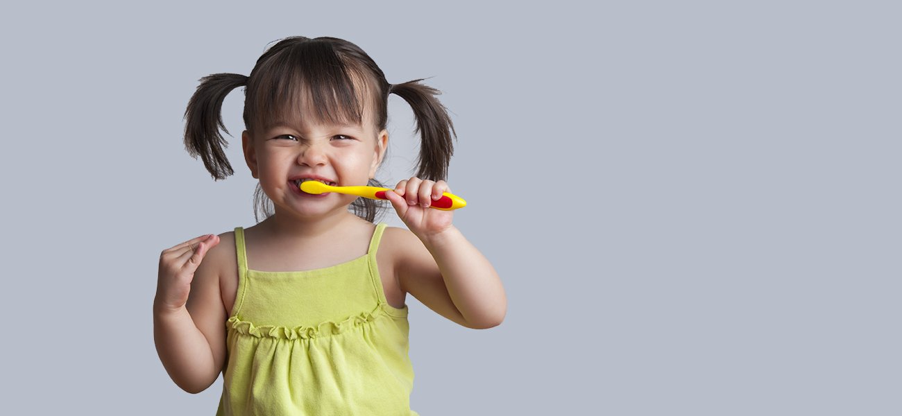 Child brushing teeth at TLC Dentistry - Sunshine Coast Dentist